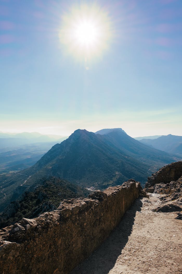 Breathtaking mountain landscape in Occitanie, France under a bright midday sun.